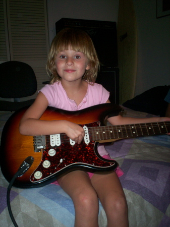 Madelyn with a guitar.