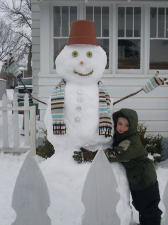 Our son Ethan & a snowman the 3 of us built