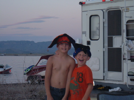 Jacob and our Nephew Justin and "The Lake" during Happy Hour (yes we all wear crazy hats!)