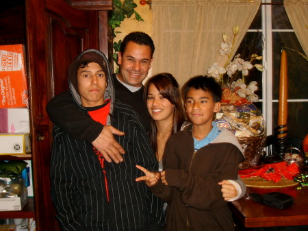 My husband Juan and my 3 step kids...