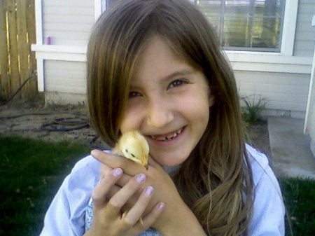 Amelia holding a chick