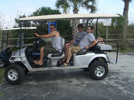 Me on our golf cart limo at the beach with Mike and Heather