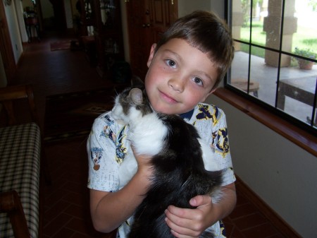 son  age 8 with his kitty