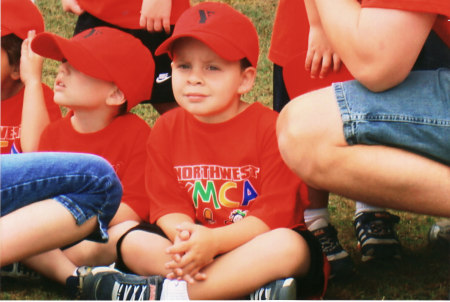 My son's 1st T-ball game  (SERIUOS LOOK)