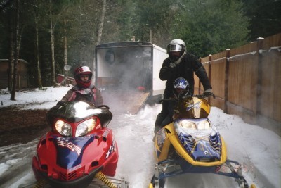 FAMILY GOING SNOWMOBILING