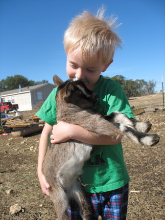 Tyler with his baby goat.