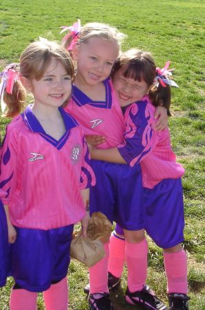 Cameron (middle) playing on the "Pink Butterflies"