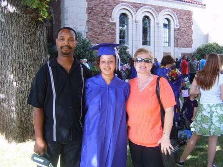 Alicia (23) with mom and dad at Dental grad.