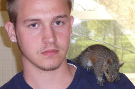 My middle son and his pet squirrel.