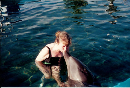 Kissing a dolphin in Mexico