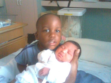 My grandson and his new baby sis.