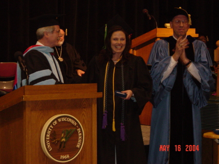 Receiving the Outstanding Graduate Award