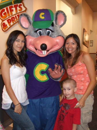 Jessica, Adam, & Jennifer with Chuck E.