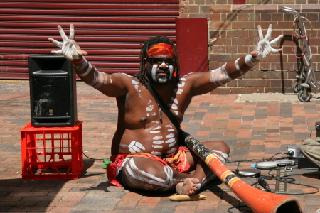 Aussie Aboriginal blowing his dijeridoo