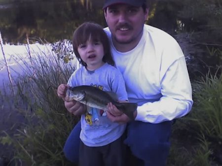 Dad and boys first fish together