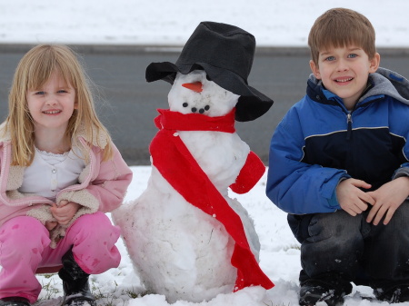 Jacob and Katie building a snowman