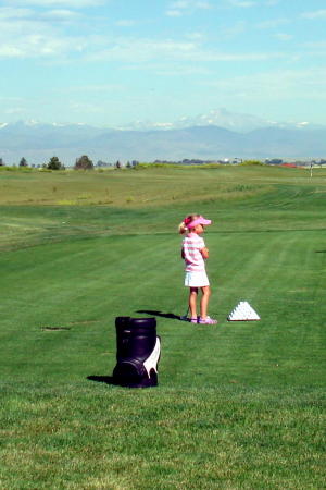 Courtney playing golf