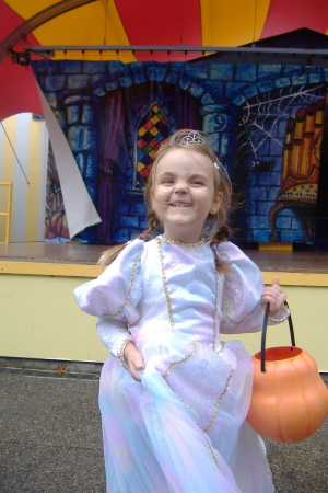 Maddie going trick or treating at sesame place.