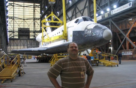 At work, with the Shuttle Orbiter.