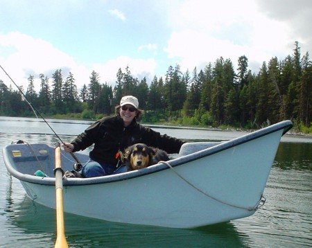 Me and my dog in our boat on the lake