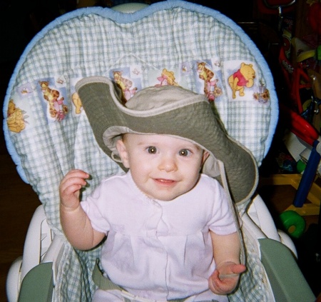 Kate playing with her papi's new work hat.