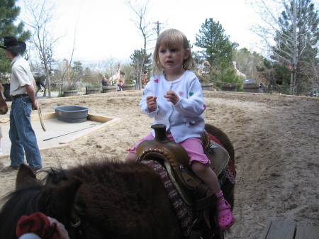 Allie on a pony ride at the zoo.