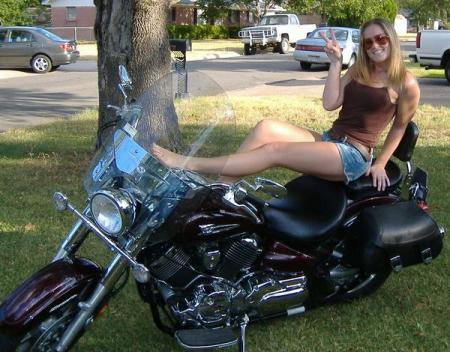 My oldest daughter, Taysha, 23...sitting on daddy's motorcycle