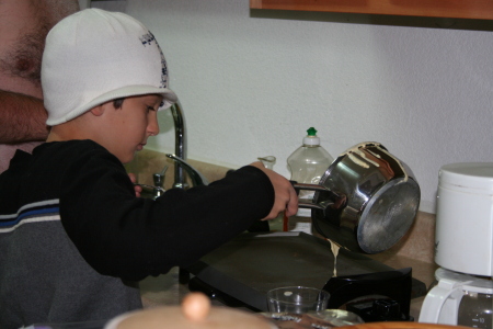Nevan making pancake breakfast