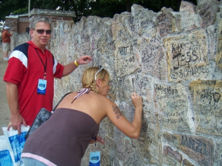 Signing the wall at Graceland