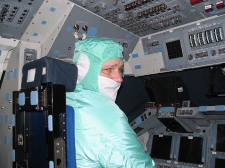 At work, inside the cockpit of the Space Shuttle Orbiter