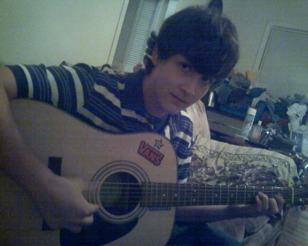 Chris and one of his guitars.