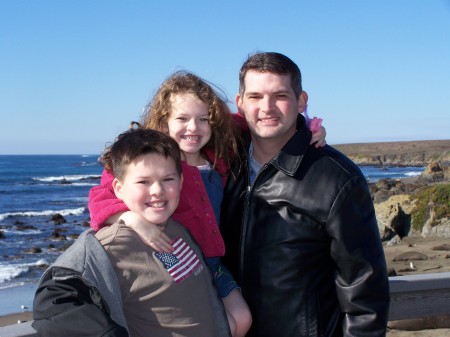 My husband John and the kids at the beach at San Simeon, CA