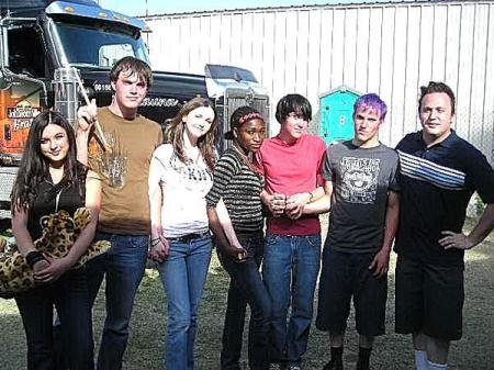 Band members Losers of the Year with some of their female fans.