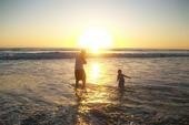 My son in law and my Grandson in the ocean Pic