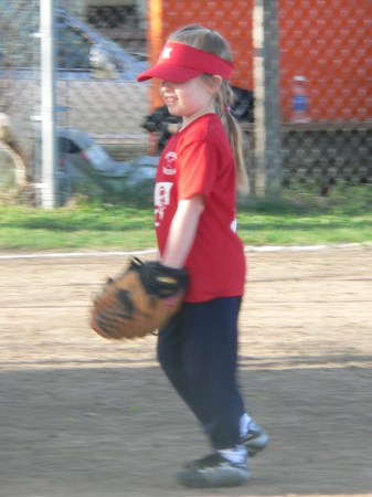 My Emily playing softball