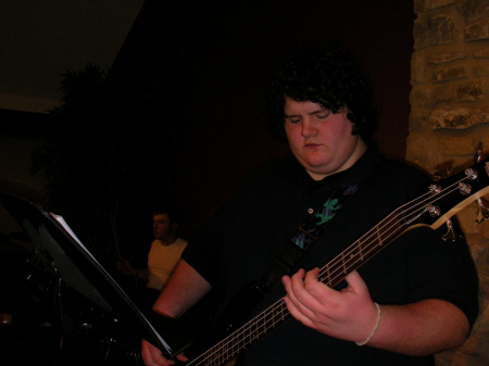 My son playing the bass guitar.