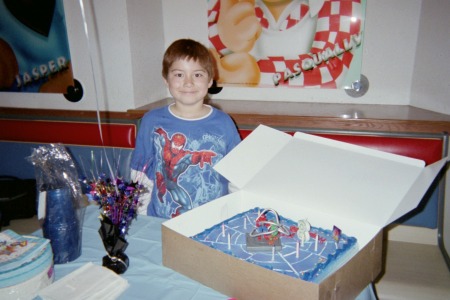 A closer look at my son with Birthday Cake at Chucky Cheese