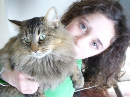 My daughter, Lizzie, and her cat whose names are legion.  Currently she is "Rat Queen."