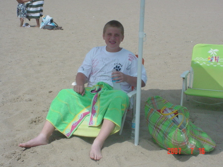 My son kickin it at the beach