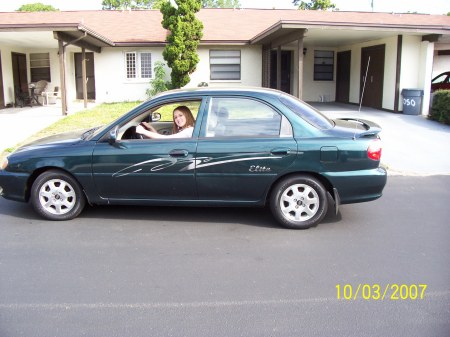 Daughter Lauren in her first car on my street