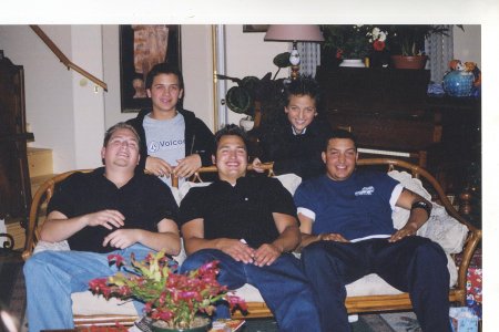 sitting on the couch my son Ricky, my son Stevie, and my sister's son Glen and behind the couch my younger sons Nico and Danny