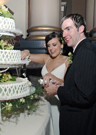 Heidi and Wes cutting their wedding cake