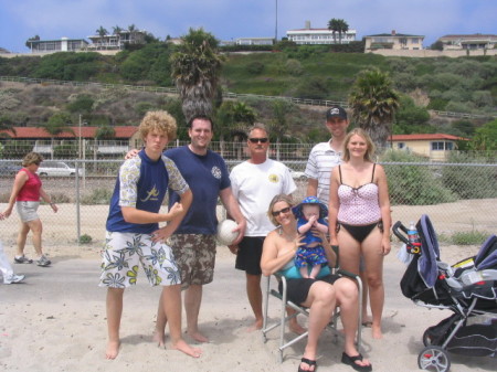 family at beach minus wife