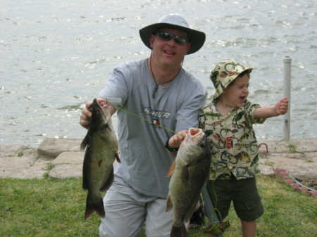 Todd, Truman and Tradition: Always a "photo op" after the fishing trip with his Papa,Todd starts early with his son (2.5 then, 4.5 now).