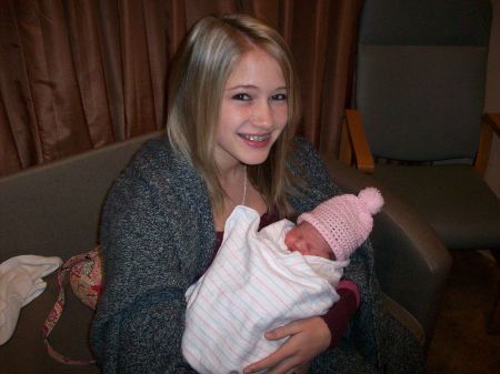 Big Sis Katelyn holding Baby Mac