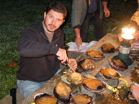 my son Paul cleaning our abalone