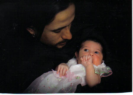 My husband and daughter at 2 weeks old