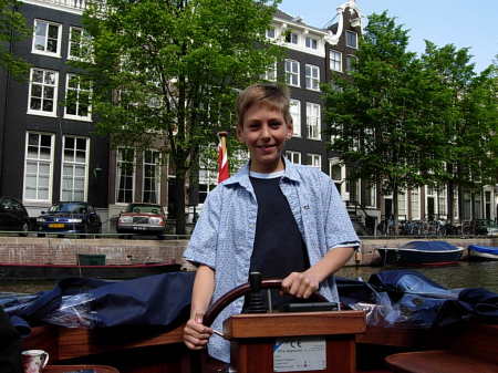 Remington Driving Boat in Amsterdam Canal