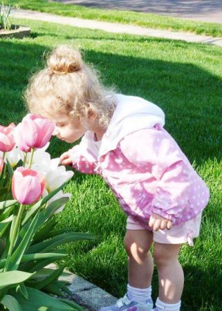 Kyleigh smelling tulips