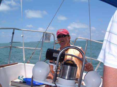 at the helm with cigar